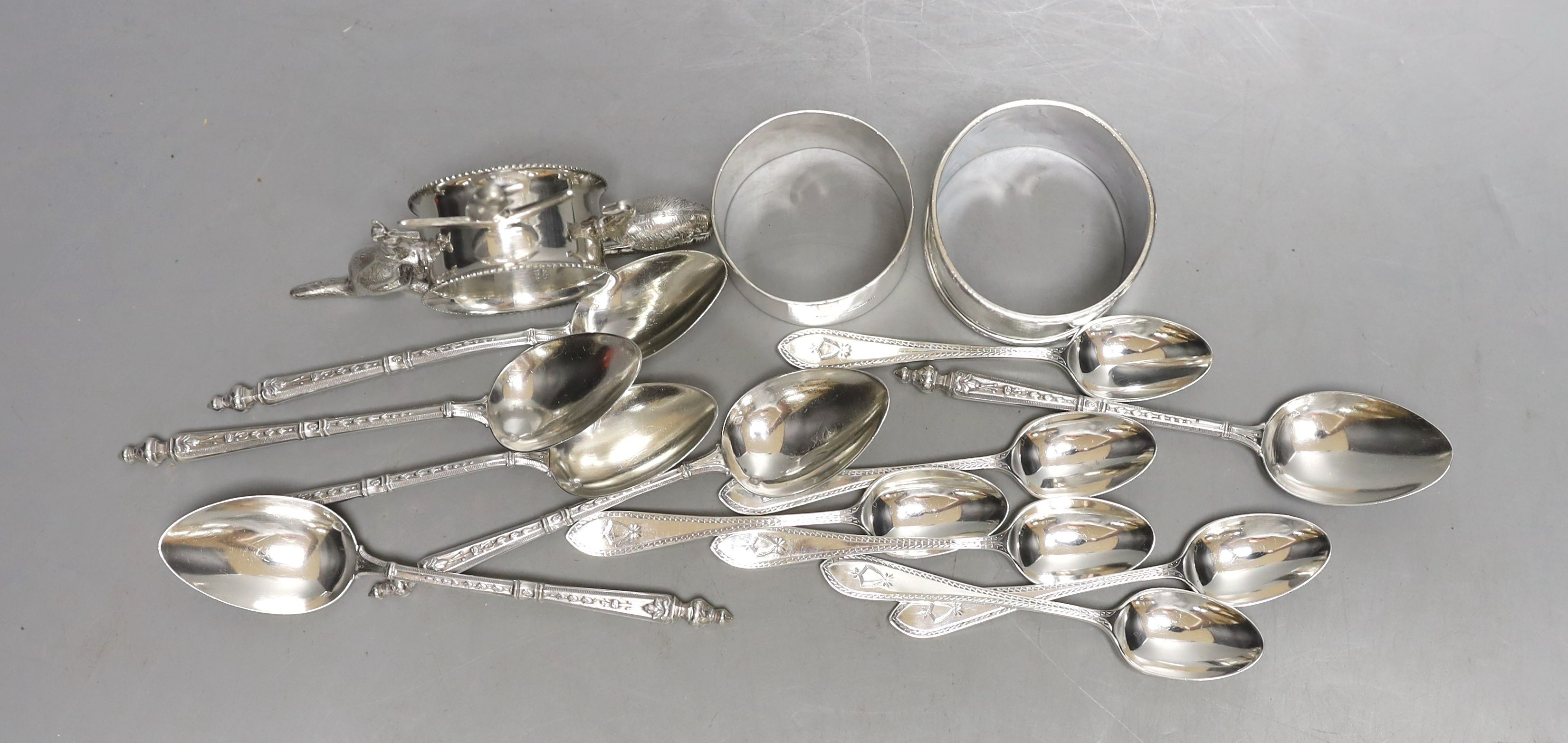 A set of six late Victorian silver coffee spoons, Sheffield, 1884, a set of six early 20th century French white metal teaspoons, two silver napkin rings and an Australian E.P.N.S. napkin ring.